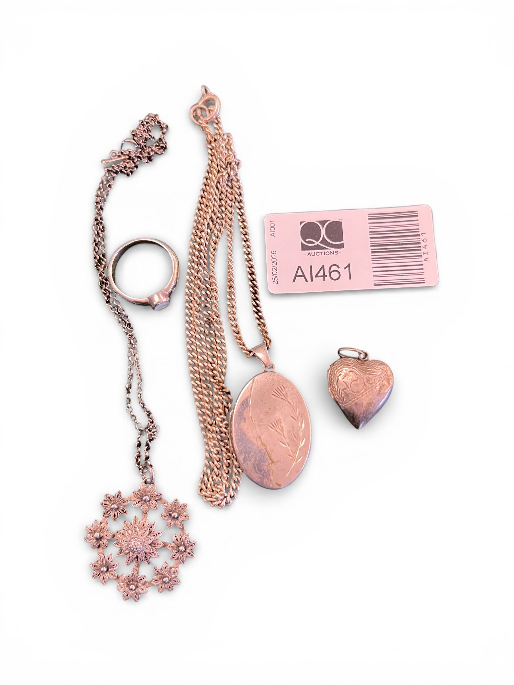 Collection of Silver Items Including a Ring, Chain and Locket, and Heart-Shaped Locket